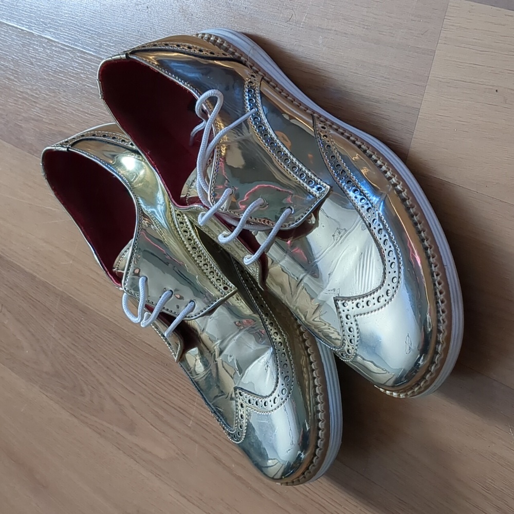 Gold patent leather wing tips